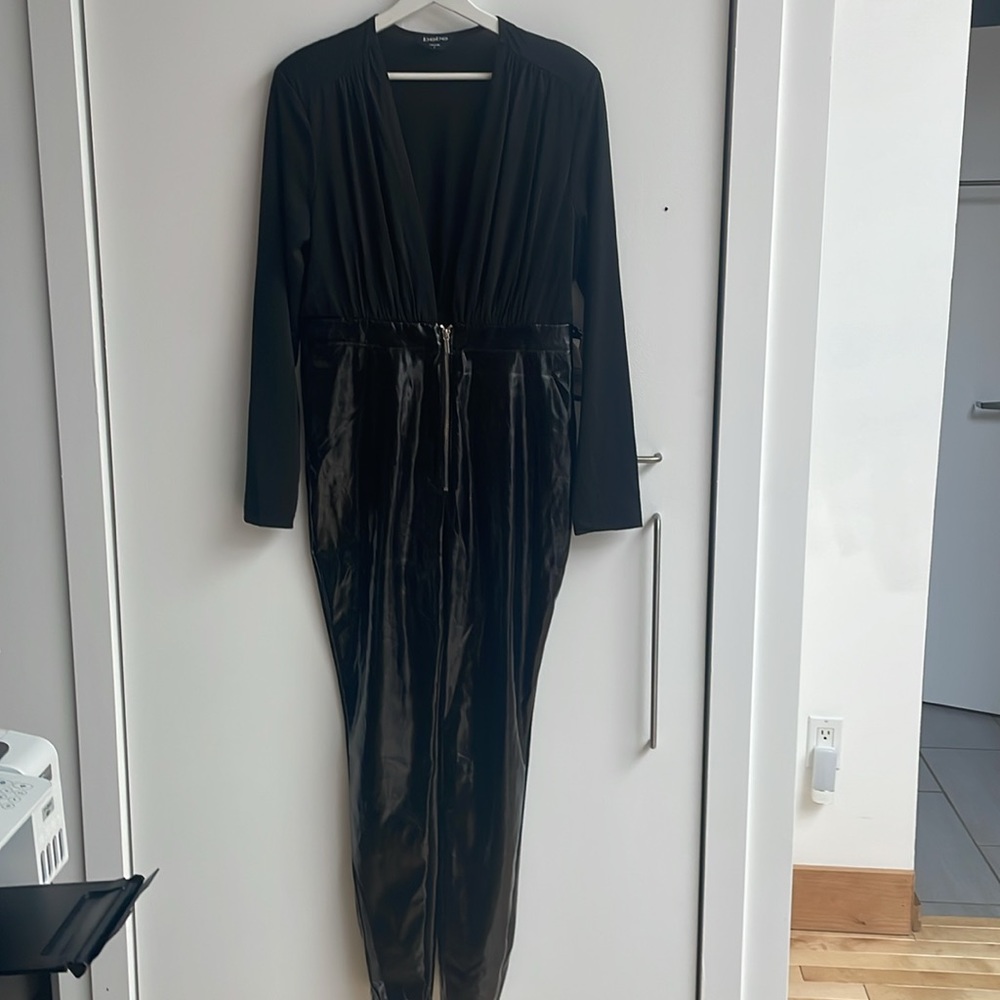 Plunge neckline, shoulder padding, vinyl pants with frontal zipper closu…